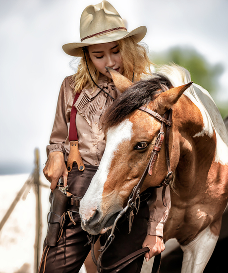 woman-standing-by-horse